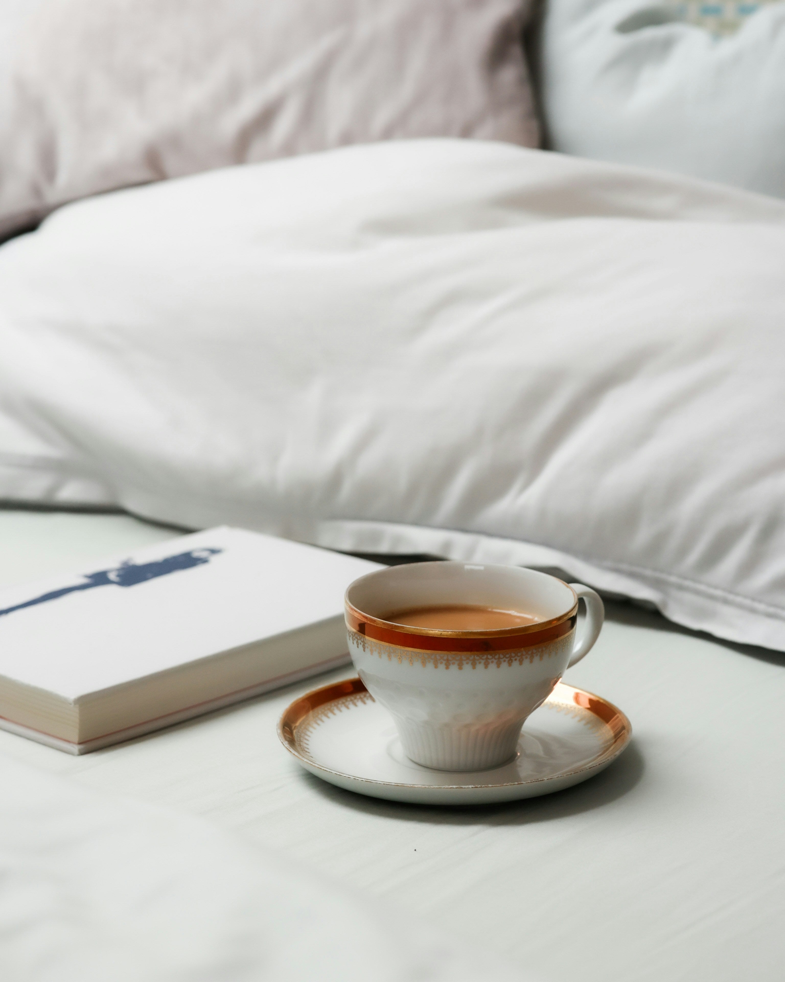 Cozy Sunday morning with tea and white linen bedding