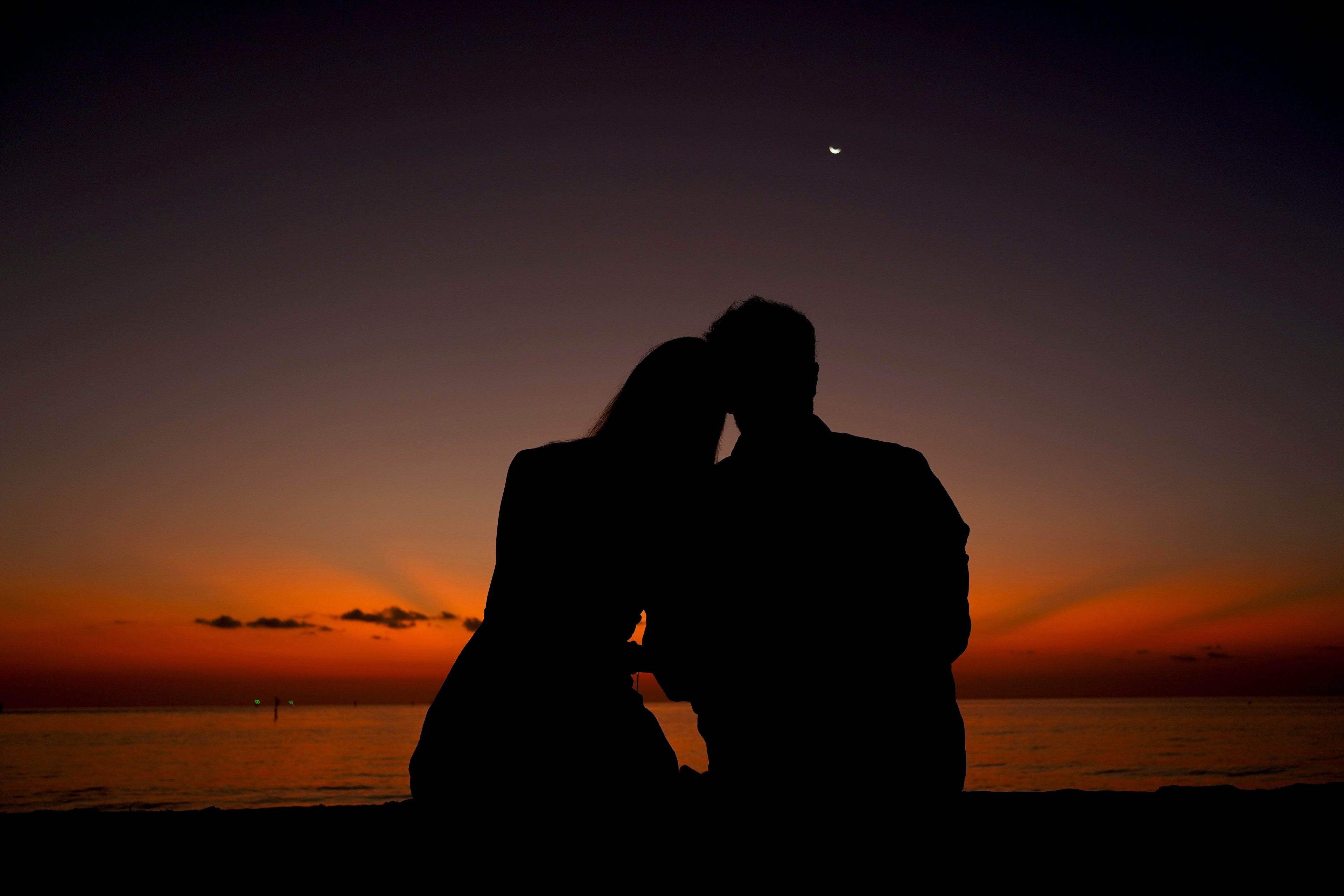 silhouette of couple at dawn