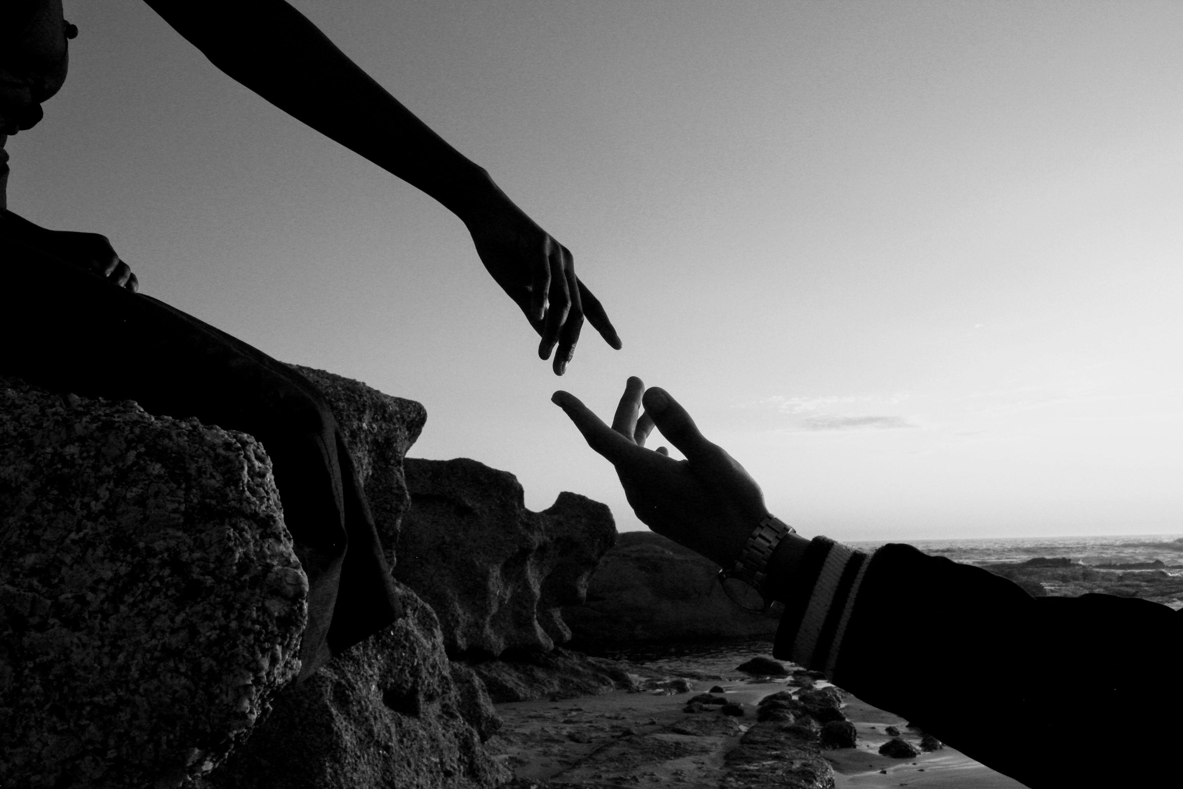 hands reaching for each other